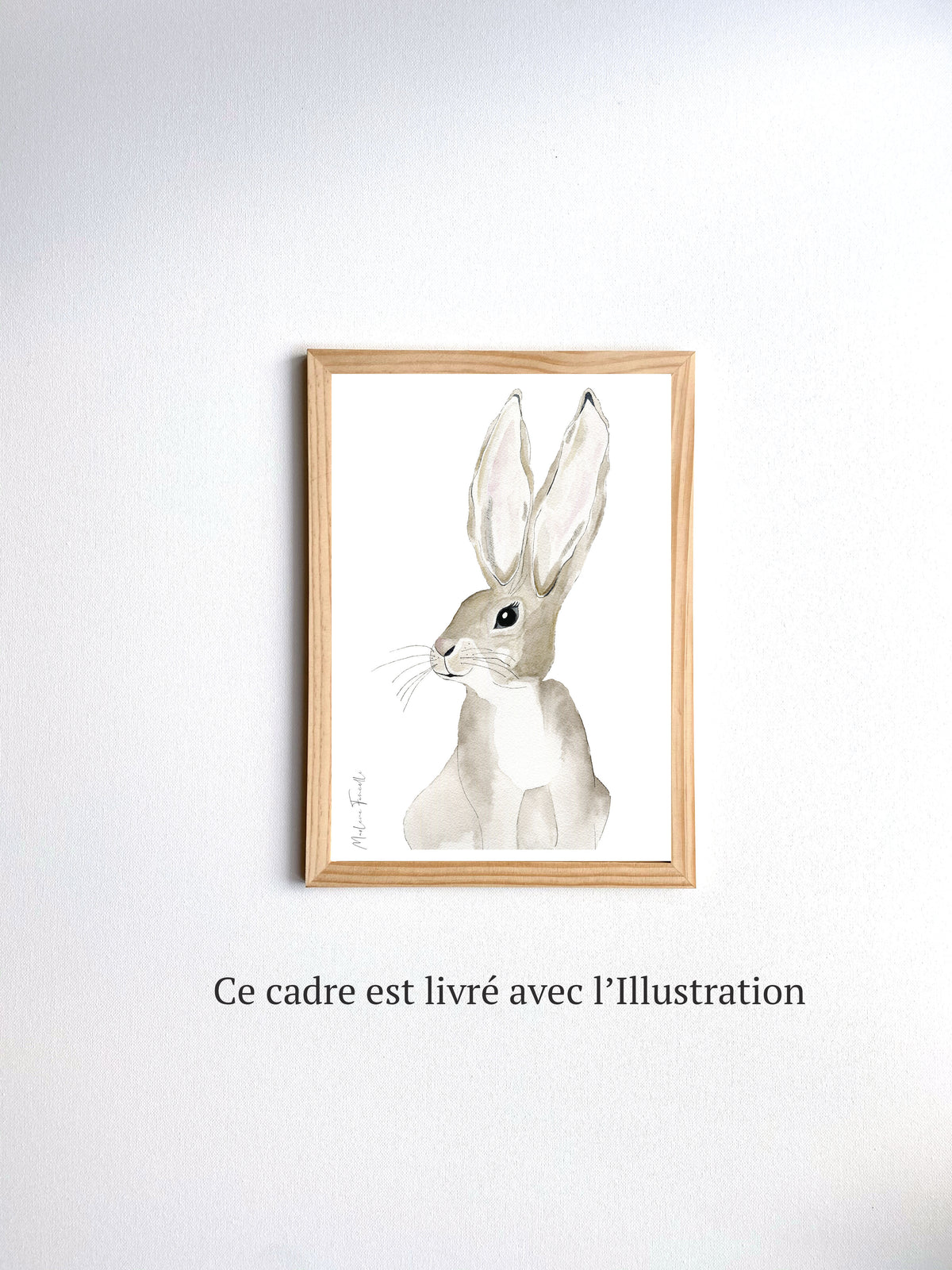Cadre avec affiche aquarelle d'un lapin avec des grandes oreilles pour décorer la chambre d'un bébé.